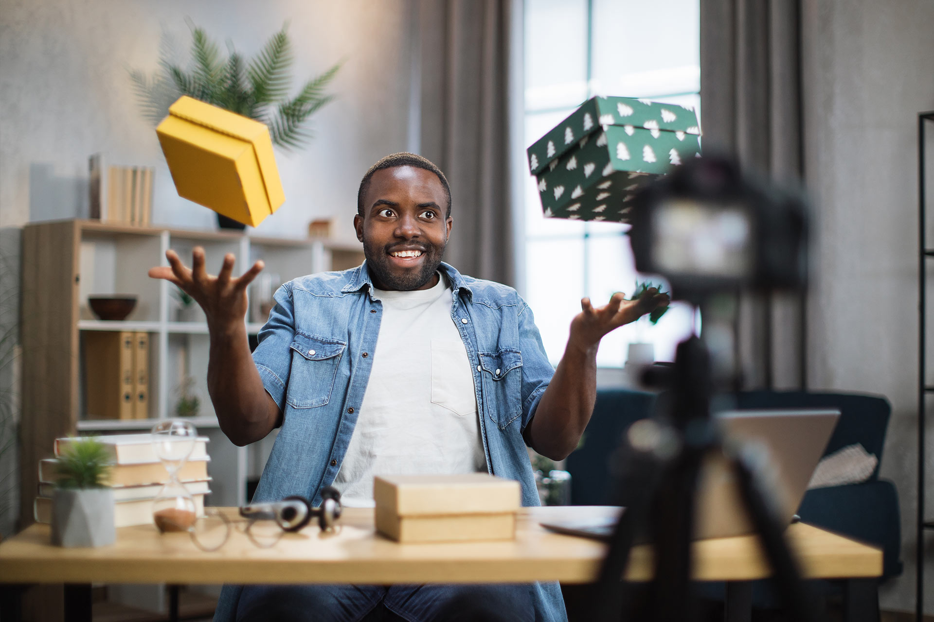 man recording video blog while unpacking presents 2022 04 27 03 23 51 utc